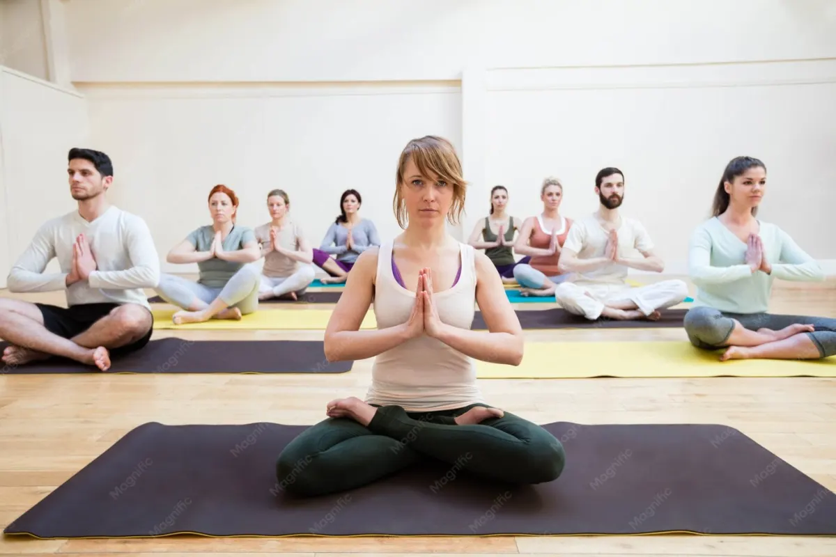 A teacher guiding a group meditation class